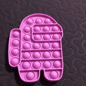 A among us pop it the color purple it’s new makes good pops nice color and good